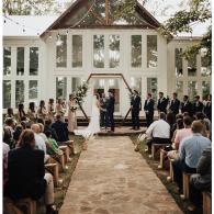 Outdoor wedding ceremony with contemporary arch